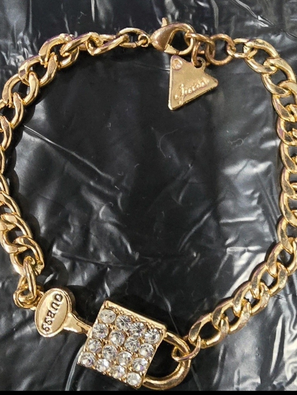 Guess Gold Tone Chain Bracelet with Crystal Square Charm